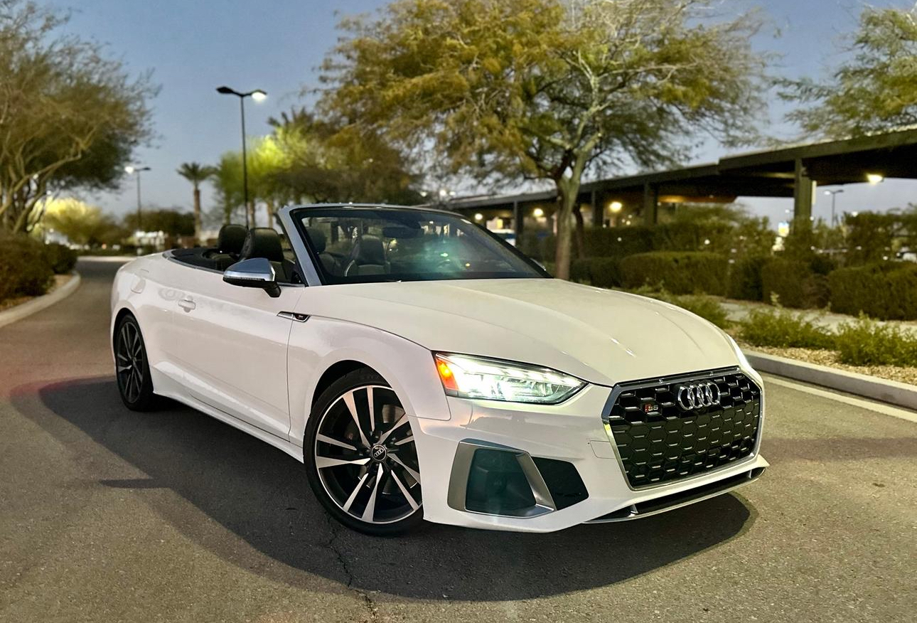 white color audi car standing on the road